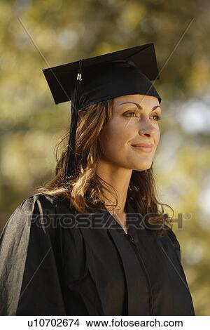 Low angle view of female graduate View Large Photo Image Picture - Low angle view of female graduate. Fotosearch