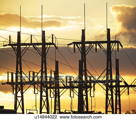 Stock Image - Low angle view of power lines on poles. Fotosearch