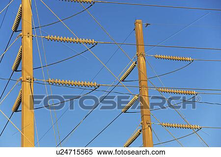 Stock Photography - Low angle view of power lines on poles. Fotosearch