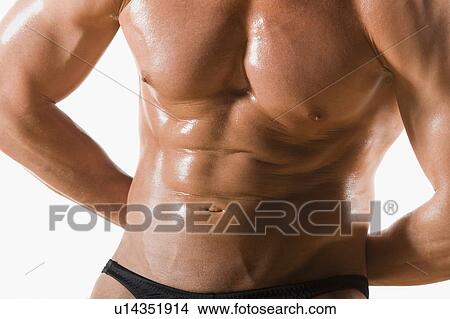 Picture - Male body builder flexing and posing. Fotosearch