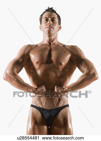 Stock Image - Male body builder flexing and posing. Fotosearch