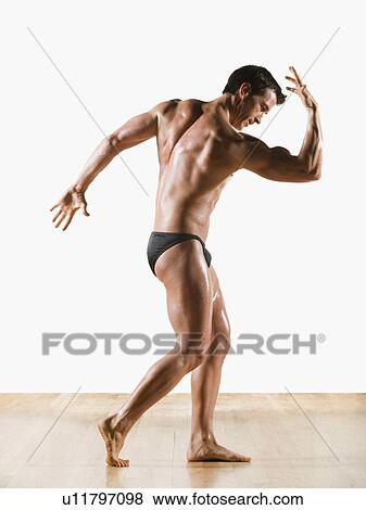 Male body builder flexing and posing View Large Photo Image Stock Photo - Male body builder flexing and posing. Fotosearch