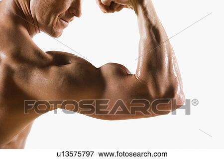 Stock Photo - Male body builder flexing and posing. Fotosearch