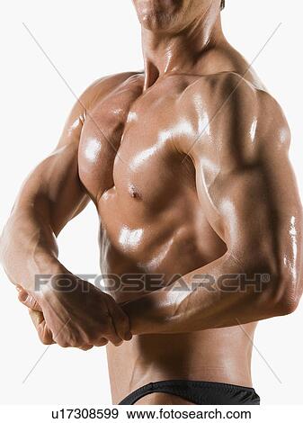 Male body builder flexing and posing View Large Photo Image Stock Photo - Male body builder flexing and posing. Fotosearch