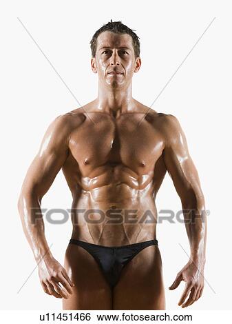 Stock Photograph - Male body builder flexing and posing. Fotosearch