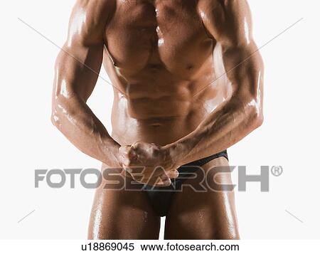 Male body builder flexing and posing View Large Photo Image Stock Photography - Male body builder flexing and posing. Fotosearch