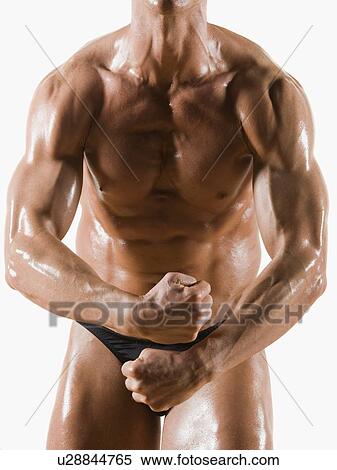Stock Photography - Male body builder flexing and posing. Fotosearch