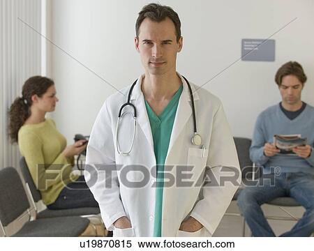 Male doctor posing in waiting room View Large Photo Image Stock Photography - Male doctor posing in waiting room. Fotosearch