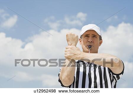 Male football referee making holding call View Large Photo Image Stock Photo - Male football referee making holding call. Fotosearch