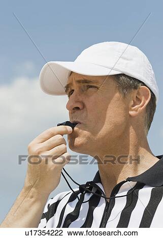 Male referee blowing whistle View Large Photo Image Stock Image - Male referee blowing whistle. Fotosearch