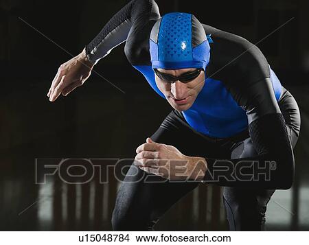 Picture - Male speed skater in ready position. Fotosearch