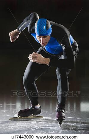 Stock Image - Male speed skater on ice. Fotosearch