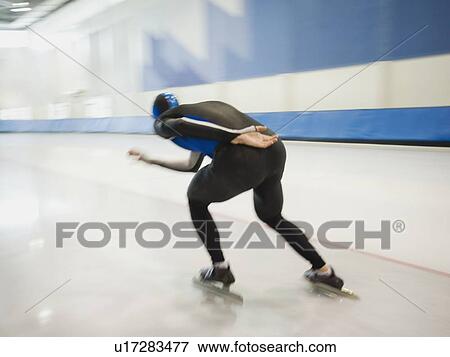 Stock Photo - Male speed skater skating. Fotosearch