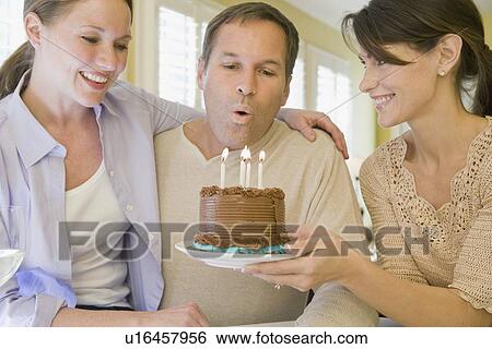 Stock Photograph - Man celebrating birthday. Fotosearch