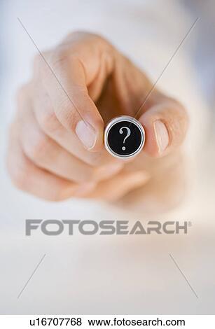 Man holding question mark View Large Photo Image Stock Photo - Man holding question mark . Fotosearch