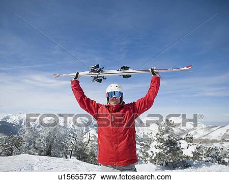 Man holding skis over head View Large Photo Image Stock Photo - Man holding skis over head. Fotosearch