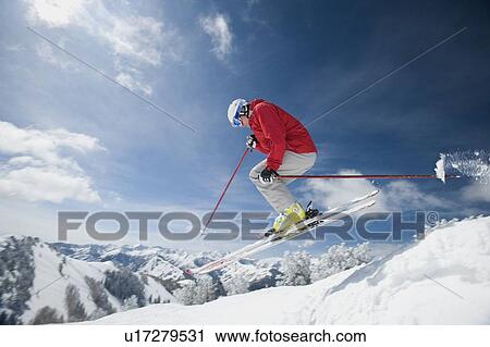 Stock Image - Man in air on skis. Fotosearch