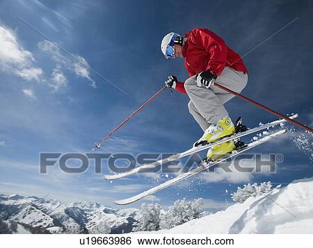 Man in air on skis View Large Photo Image Stock Photograph - Man in air on skis. Fotosearch
