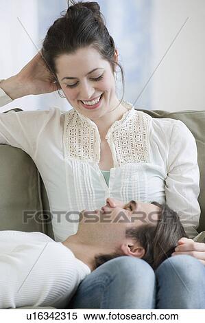 Man laying in girlfriend’s lap View Large Photo Image Stock Photography - Man laying in girlfriend’s lap. Fotosearch