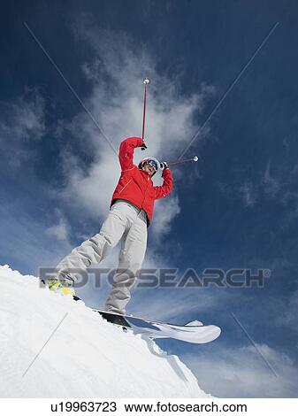 Man on skis with arms raised View Large Photo Image Stock Image - Man on skis with arms raised. Fotosearch