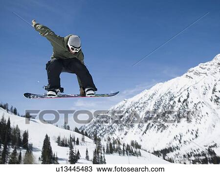 Man on snowboard in air, Wasatch Mountains, Utah, United States View Large Photo Image Stock Image - Man on snowboard in air, Wasatch Mountains, Utah, United States. Fotosearch
