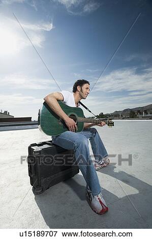 Man playing guitar View Large Photo Image Stock Photo - Man playing guitar. Fotosearch