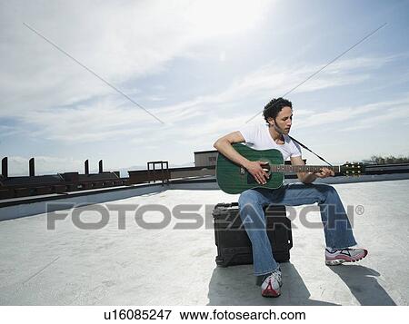 Stock Photo - Man playing guitar. Fotosearch