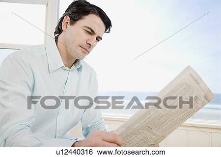 Man reading newspaper View Large Photo Image Stock Photograph - Man reading newspaper. Fotosearch
