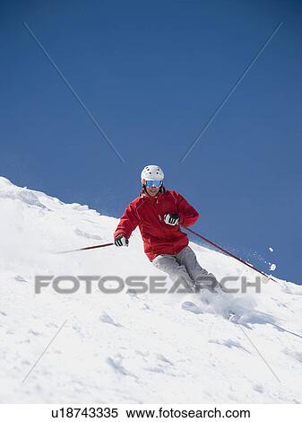 Stock Photography - Man skiing downhill. Fotosearch
