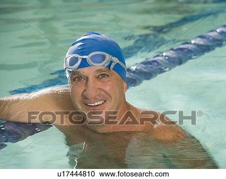 Man smiling in swimming pool View Large Photo Image Stock Image - Man smiling in swimming pool. Fotosearch