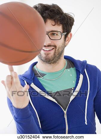 Man spinning basketball on finger View Large Photo Image Picture - Man spinning basketball on finger. Fotosearch