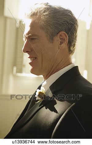 Man wearing tuxedo with boutonniere View Large Photo Image Picture - Man wearing tuxedo with boutonniere. Fotosearch