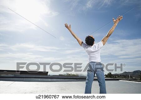 Stock Photo - Man with arms raised. Fotosearch
