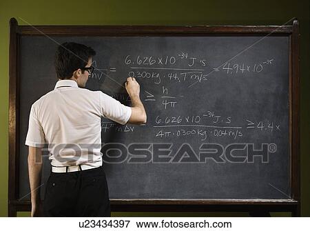 Stock Photo - Man writing on blackboard. Fotosearch