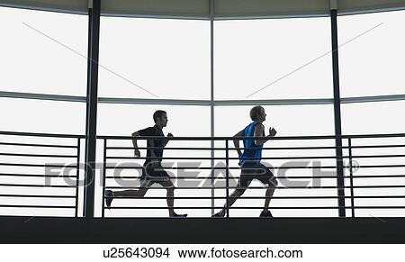 Men running on indoor track View Large Photo Image Picture - Men running on indoor track. Fotosearch
