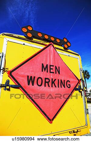 Picture - men working sign. Fotosearch