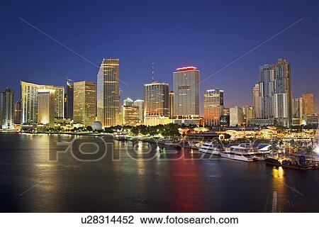 Stock Image - Miami city skyline at night, Dade County, Florida, United States. Fotosearch