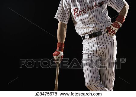 Midsection portrait of baseball player leaning on bat View Large Photo Image Stock Photo - Midsection portrait of baseball player leaning on bat. Fotosearch