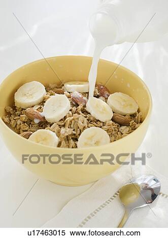 Milk pouring into cereal bowl View Large Photo Image Stock Photography - Milk pouring into cereal bowl. Fotosearch