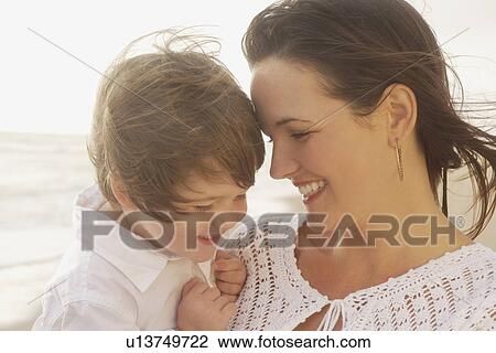 Stock Image - Mother and child laughing. Fotosearch