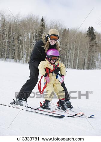 Mother and child skiing View Large Photo Image Stock Image - Mother and child skiing. Fotosearch
