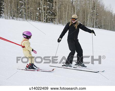 Stock Photo - Mother and child skiing. Fotosearch