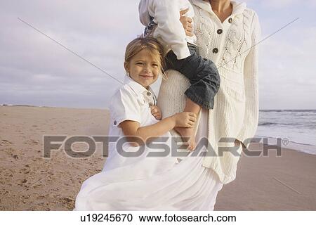 Mother and children at beach View Large Photo Image Stock Image - Mother and children at beach. Fotosearch