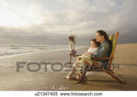 Mother and children at beach View Large Photo Image Stock Image - Mother and children at beach. Fotosearch