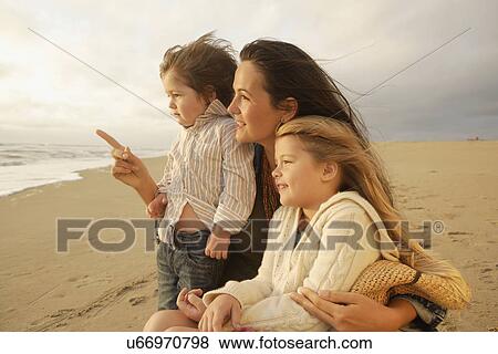 Mother and children at beach View Large Photo Image Stock Photo - Mother and children at beach. Fotosearch