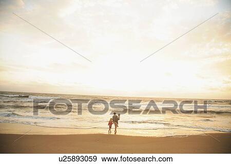 Mother and children watching sunset View Large Photo Image Stock Photo - Mother and children watching sunset. Fotosearch
