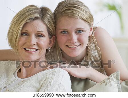 Stock Image - Mother and daughter hugging. Fotosearch
