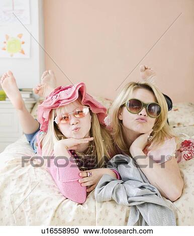Mother and daughter playing dress up View Large Photo Image Stock Image - Mother and daughter playing dress up. Fotosearch