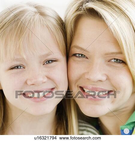 Mother and daughter touching cheeks View Large Photo Image Picture - Mother and daughter touching cheeks. Fotosearch