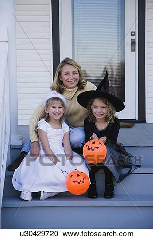 Mother and daughters dressed in witch and princess Halloween costumes View Large Photo Image Stock Image - Mother and daughters dressed in witch and princess Halloween costumes. Fotosearch
